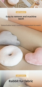 Detail of soft faux rabbit fur heart pillow with removable inner lining and zipper
