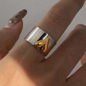 Minimalist wide band stainless steel ring with 3D gold heart detail for women