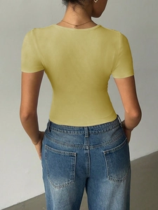 Rear view detail of a yellow V-neck short sleeve top with high-quality cotton fabric