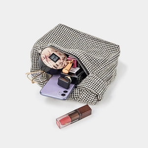 Elegant silver rhinestone clutch bag showing spacious interior with luxury daily essentials