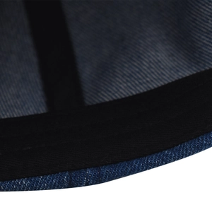 Close-up of navy blue denim baseball cap showing detailed inner stitching and fabric texture