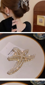 Detail of starfish hair claw with sparkling rhinestones and elegant pearls on gold metal