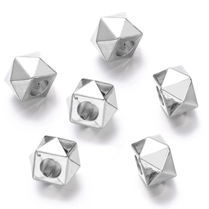 Macro view of silver faceted geometric CCB beads with large holes for DIY jewelry making