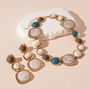 Vintage gold textured jewelry set with geometric resin marble pendants and necklace