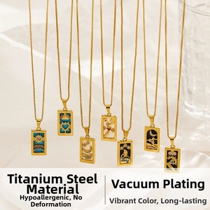 Detailed macro view of gold titanium steel tarot pendant necklaces with enamel inlay