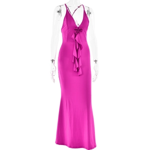 Close-up of pink halter maxi dress featuring ruffled neckline and fabric flower detail