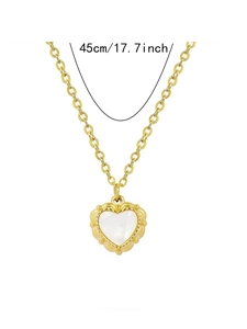 Detail shot of golden heart pendant with pearl inlay and 45cm chain length measurement