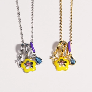 Detail of gold and silver enamel necklaces with star, flower, and heart-shaped charms