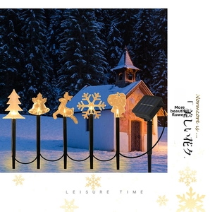 Solar outdoor Christmas garden stakes with star, snowflake and reindeer glowing warm light