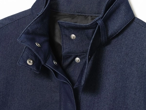 Detail of navy blue bomber jacket with stand collar and silver metal press studs