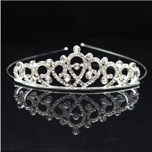 Elegant silver crown headband with sparkling rhinestones and bow design for girls