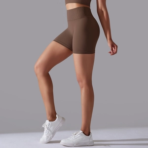 Detail of high-waisted seamless ribbed workout shorts in brown for yoga and fitness