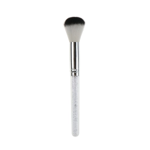 Detail of a blush brush featuring bicolored bristles and a transparent glitter-filled handle