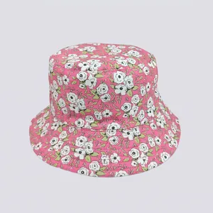 Detailed close-up of rose flower print and durable cotton fabric on the sun bucket hat
