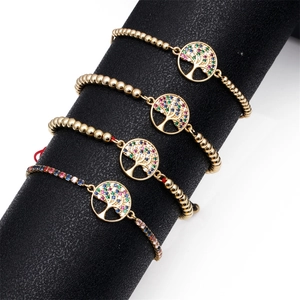 Detail of four-piece Tree of Life bracelets with colorful zircons and golden bead chains