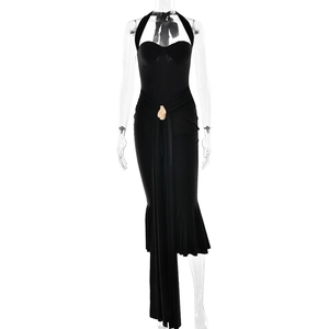 Slim fit black halter neck dress with gold waist buckle and asymmetrical fish-tail hemline