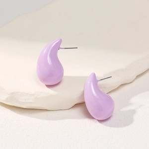Close-up of minimalist lavender teardrop stud earrings with a glossy ceramic-like finish