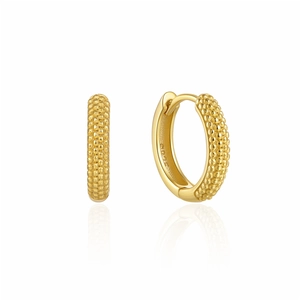 Macro shot of S925 sterling silver hoop earrings with gold-plated beaded texture