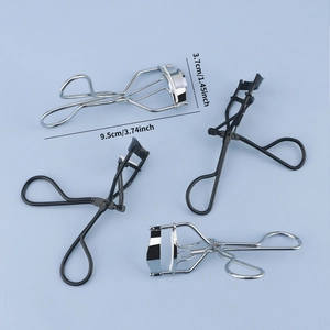 Stainless steel eyelash curler set with ergonomic handles and silicone pads on blue background