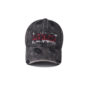 Close-up of vintage washed gray baseball cap with red New York embroidery and distressed detail