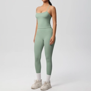 Green high-waist yoga leggings and crop top set shown on model in studio