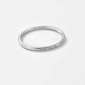 Minimalist S925 sterling silver ring featuring a row of sparkling diamonds on white background
