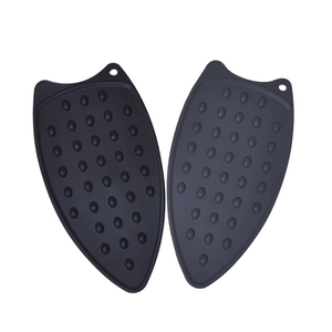 Heat resistant silicone iron rest pads in black and grey with non-slip texture