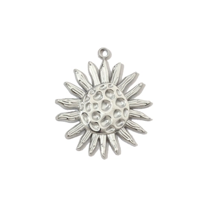 Close-up of silver sunflower pendant in stainless steel with detailed metal petals