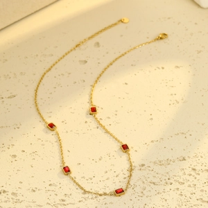 Luxury gold necklace featuring five rectangular red zircon stones on a fine chain