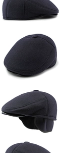 Detail view of winter newsboy hat with ear flaps and wool texture in dark charcoal