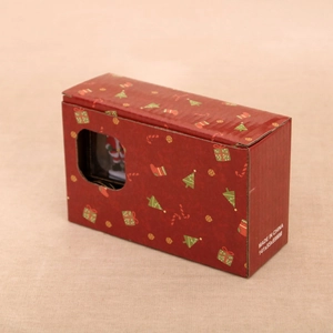 Detail of red Christmas gift box with festive patterns and size 141x55x89mm