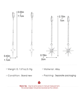 Silver gothic star drop earrings with dimensions and lever back detail on white background
