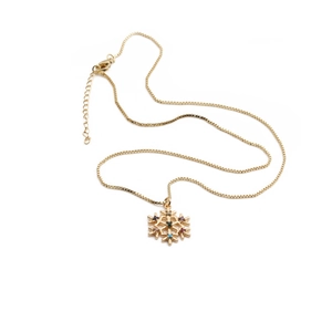 Gold plated Christmas snowflake necklace with colorful zircon stones on white background