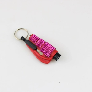 Detail view of red and pink emergency car escape tools with silver metal keyrings