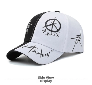 Close-up of fashion baseball cap featuring black and white patchwork and graffiti print