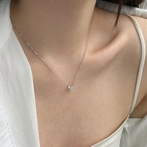 Minimalist S925 sterling silver necklace with heart-shaped pendant worn by a model