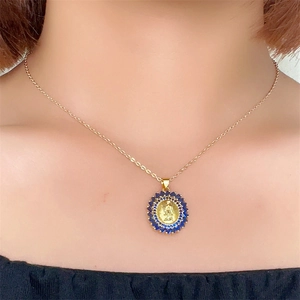 Gold Virgin Mary pendant necklace for women with blue zircon inlay on circular frame
