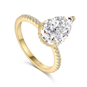 Sparkling S925 sterling silver ring with pear cut zircon and golden plated pavé band