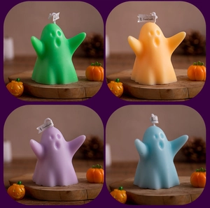 Macro set of four colorful ghost scented candles in green orange purple and blue hues