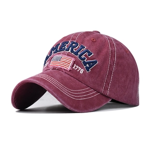 Detail of vintage washed cotton baseball cap with embroidered American flag and 1776 text