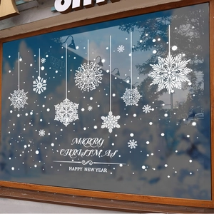 White Christmas snowflake static window decals with Merry Christmas text on glass shopfront