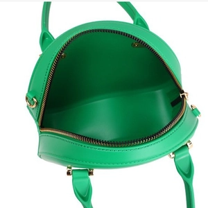 Bright green PVC round jelly cross-body bag with golden hardware and spacious interior