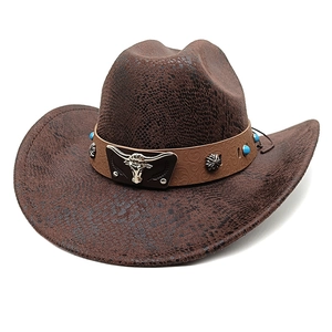Close-up of brown faux snakeskin cowboy hat with bull head badge and turquoise beads