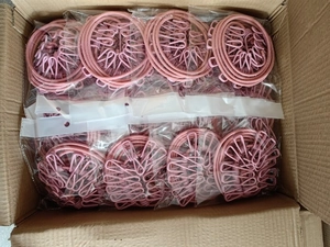 Pink multi-clip drying racks packed in transparent bags for outdoor travel laundry use