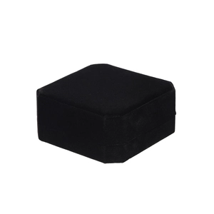 Detailed top view of black velvet jewelry box for bracelets and rings on white background