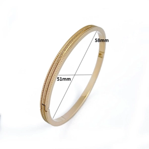 Detail shot of golden frosted stainless steel bracelet with 58mm by 51mm dimensions