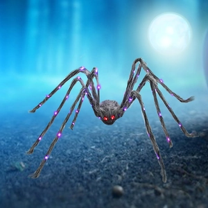 Giant Halloween black plush spider with purple LED lights and glowing red eyes outdoor decor