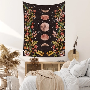 Detailed moon phase wall tapestry with botanical flowers in a minimalist bedroom setting