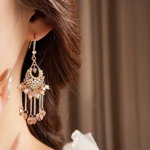 Bohemian vintage tassel drop earrings with colorful zircon and pearls on a model