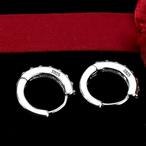 Elegant S925 sterling silver huggie earrings with a single row of red zircon stones